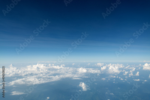 Top view cloudy mountains from a plane © xy
