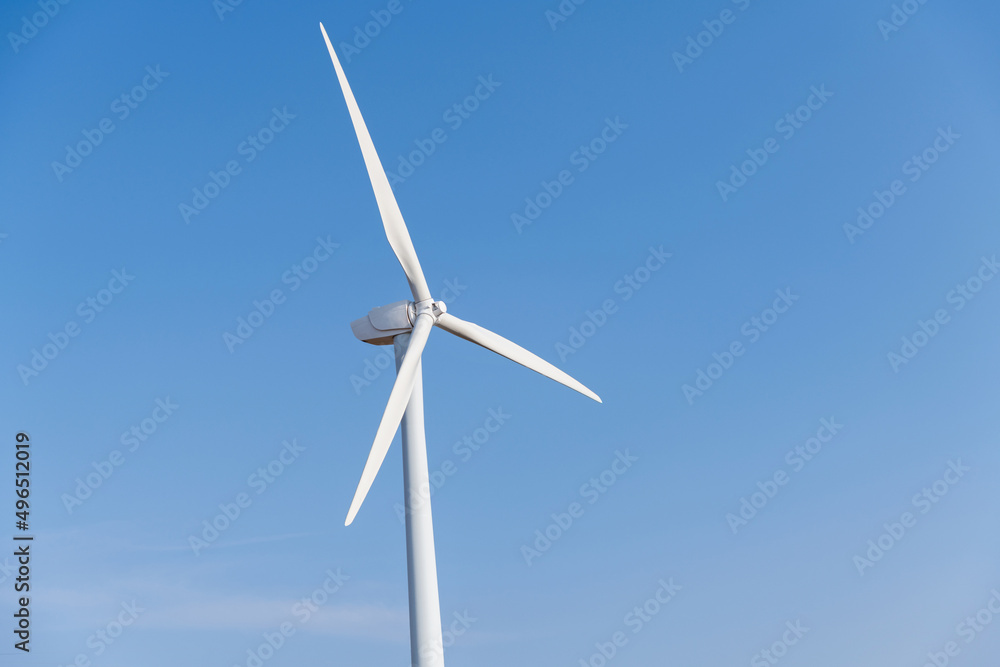 Windmill against blue sky with copyspace Windmill against blue sky with copyspace