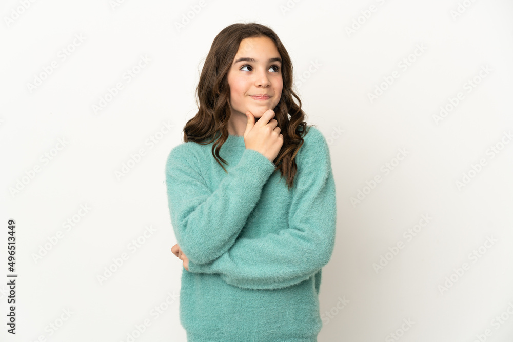 Little caucasian girl isolated on white background thinking an idea while looking up Little caucasian girl isolated on white background thinking an idea while looking up