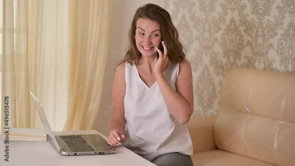 Young business woman professional talking on phone hear good news, rejoice sit at home office. Excited overjoyed celebrating success. Incredible great opportunity concept Young business woman professional talking on phone hear good news, rejoice sit at home office. Excited overjoyed celebrating success. Incredible great opportunity concept