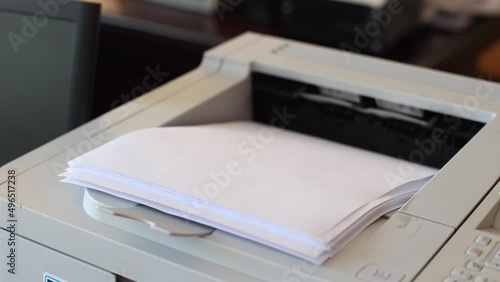 Office laser printer printing on A4 paper. The process of printing on paper using a printer.