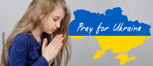 Pray for Ukraine. Prayer. The girl is praying. War in Ukraine.