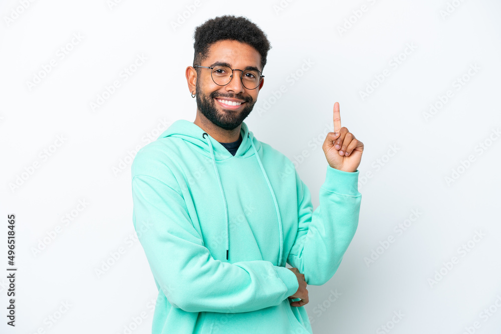 Young Brazilian man isolated on white background happy and pointing up Young Brazilian man isolated on white background happy and pointing up
