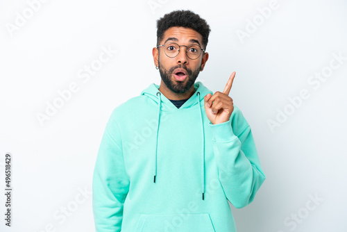 Young Brazilian man isolated on white background intending to realizes the solution while lifting a finger up