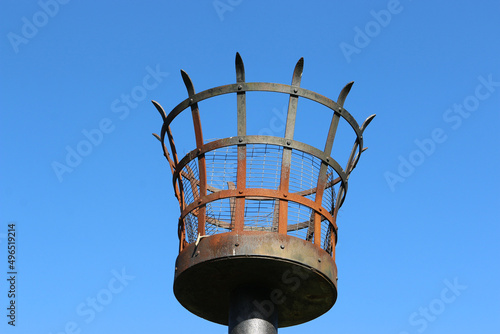 Metal basket fire beacon on pole