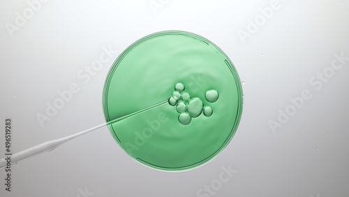 Top view shot of different sized air bubbles comes out from a lab dropper and float on the surface of green fluid in petri dish on light grey background | Abstract cosmetics formulating concept