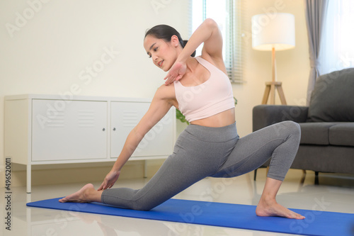 Fit woman doing yoga and meditation at home, sport and healthy lifestyle concept.