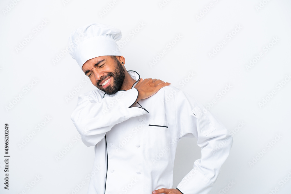 Young Brazilian chef man isolated on white background suffering from pain in shoulder for having made an effort Young Brazilian chef man isolated on white background suffering from pain in shoulder for having made an effort