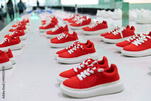 Group of children sports shoes in the store