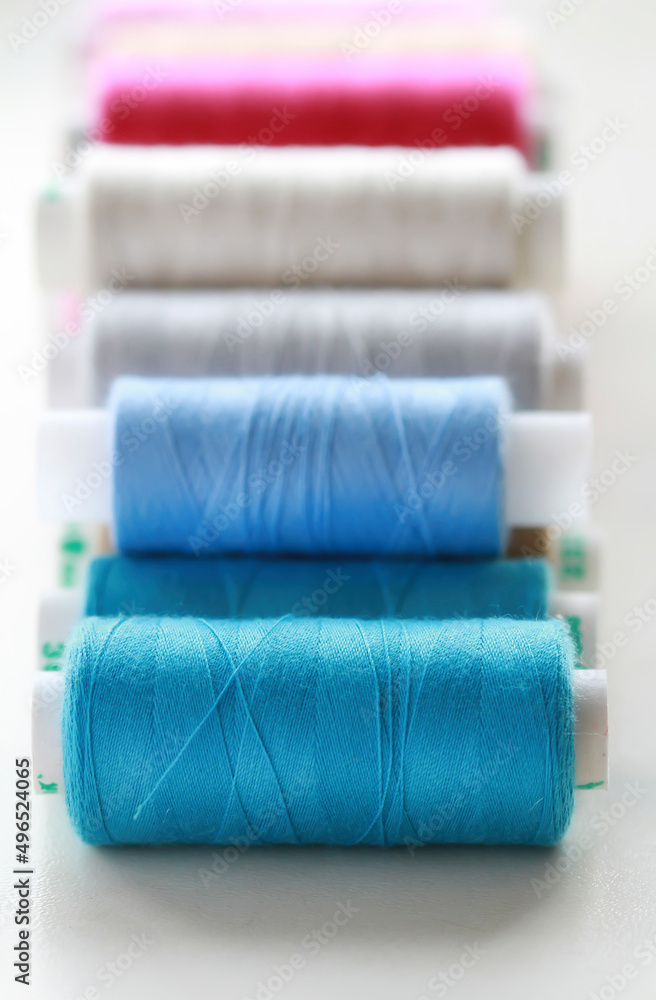Sewing threads multicolored background closeup Sewing threads multicolored background closeup