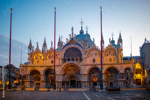 Murais de parede An empty St Marks square in Venice with the bell tower and the cathedral at dawn