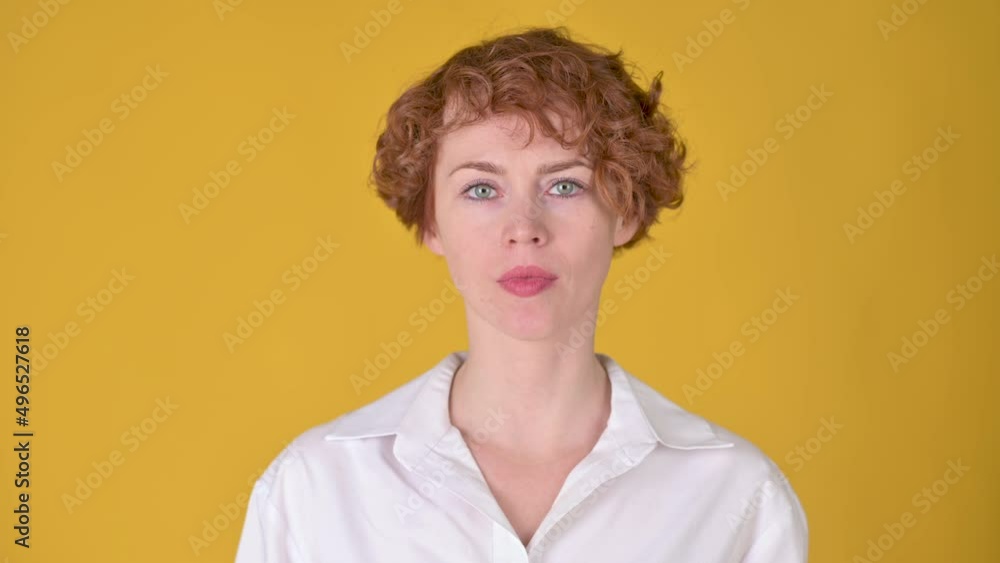 Young girl considering serious plan isolated on yellow background. Pondering a solution, doubting question.	