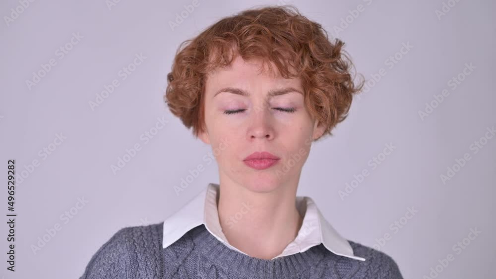 A young girl is considering a serious plan, isolated on a white background. Considering a decision, a doubtful question. A young girl is considering a serious plan, isolated on a white background. Considering a decision, a doubtful question.