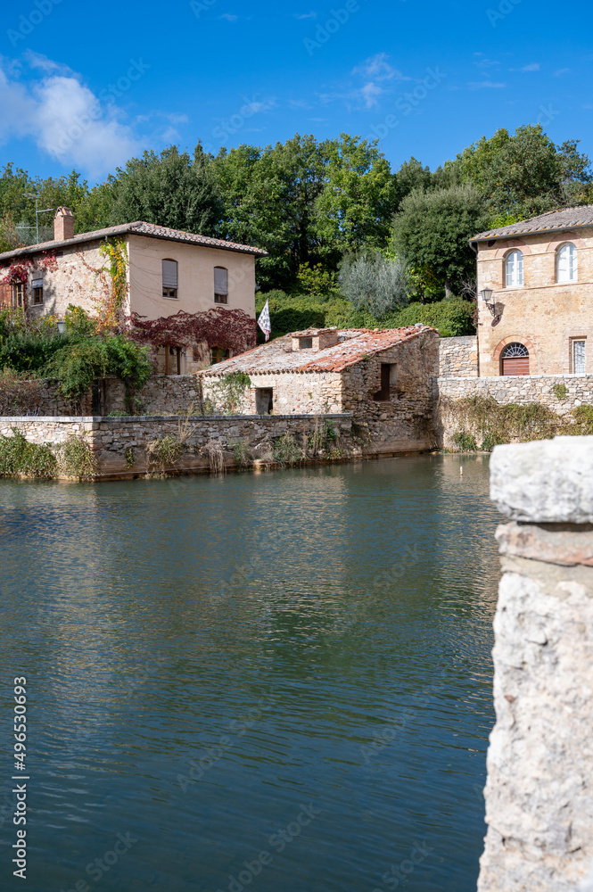 Obraz premium Ancient natural hot springs pool in small Italian village Bagno Vignoni in Tuscany