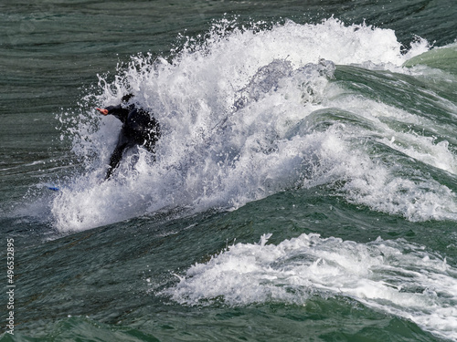 a surfer surf a wave in italy © manola72