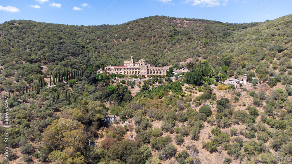 Aerial drone view of Monastery of San Jerónimo de Valparaíso in Cordoba, Spain. Nestling in the mountains of Cordoba and surrounded by native Mediterranean vegetation, stands this impressive monastery