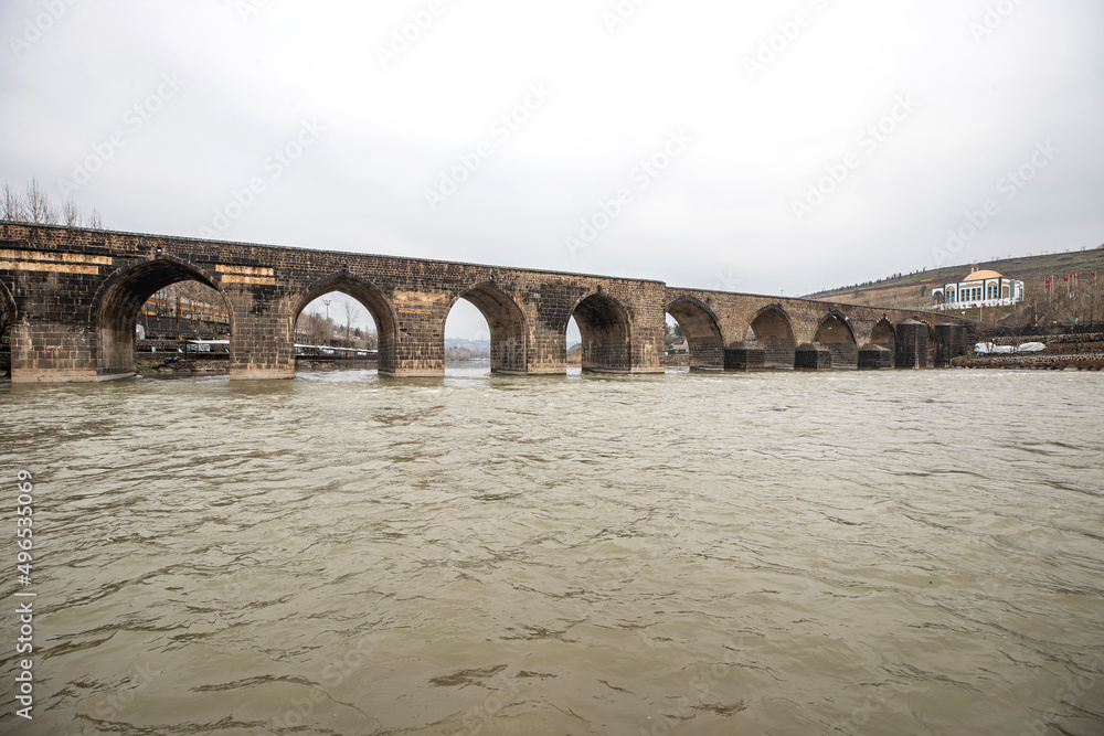 Historical Diyarbakır ten-eyed bridge and reflection of the Tigris river