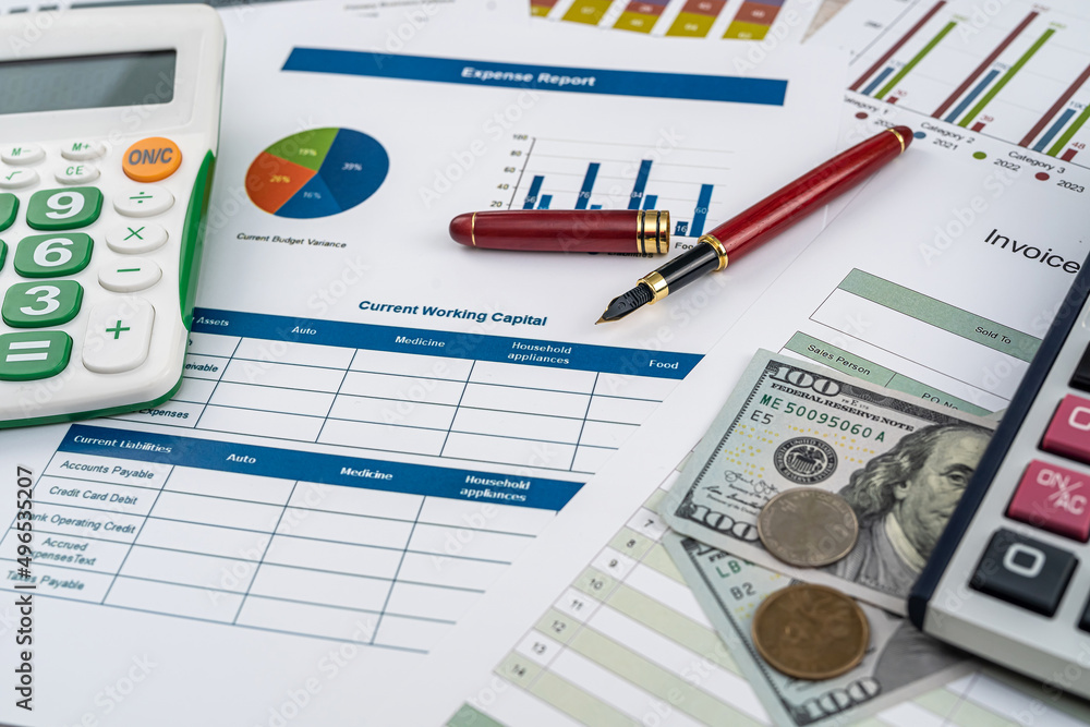 documents with graphs and diagrams and pen calculator us dollar on deks documents with graphs and diagrams and pen calculator us dollar on deks