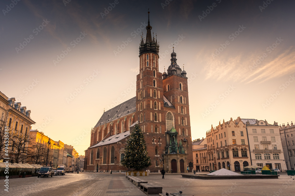 Beautiful sunrise over St. Mary Basilica in Rynek Glowny, Krakow, Poland