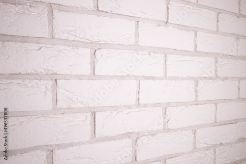 Textured white brick background. Decorative tiles for wall decoration. White decorative brick. Loft decor style. Structural surface that mimics brick