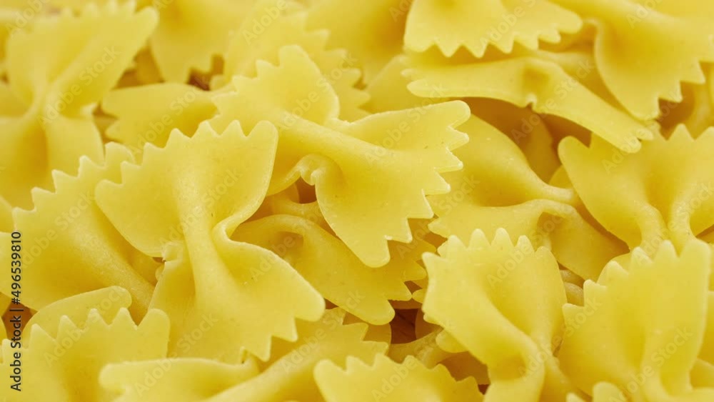 Farfalle - bow shaped pasta loopable background. Farfalle - bow shaped pasta loopable background.