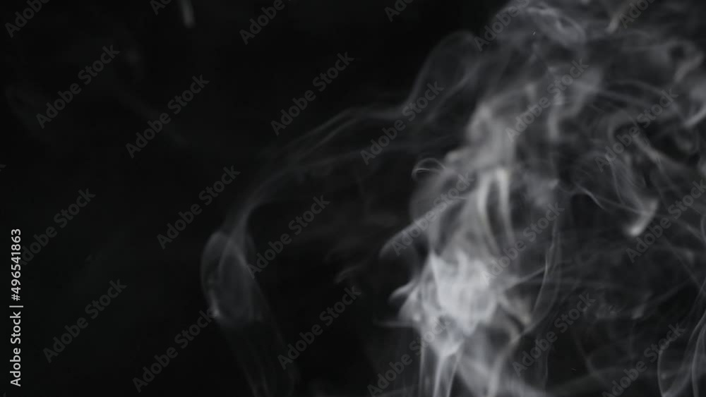 Smoke billowing over a black background.
Smoke on black background in slow motion. Smoke billowing over a black background.
Smoke on black background in slow motion.