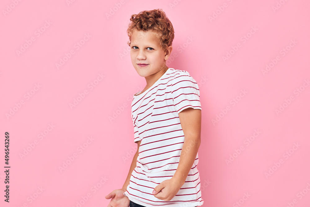 boy with curly hair posing hand gesture pink color background boy with curly hair posing hand gesture pink color background