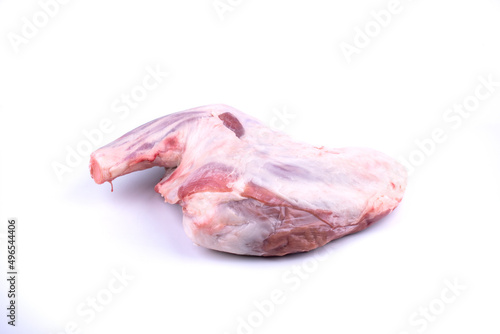 butcher shop - raw lamb shank isolated on white background angle view