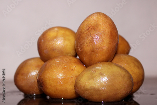 Close-up view of the fresh sapodilla fruits. photo