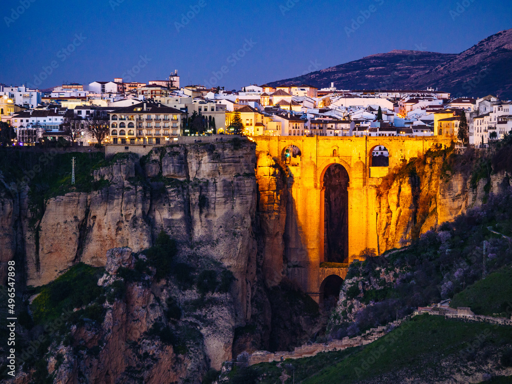 Night view of Ronda town with old bridge, Andalusia, Spain.