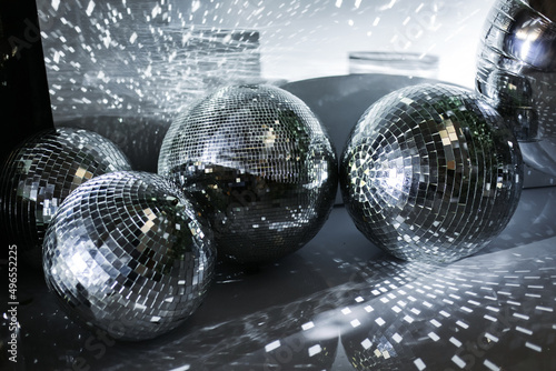 Festive background. Many disco ball on silver background. Christmas. Wedding. Birthday