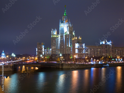 Evening picture of high building on river. Moscow  Russia