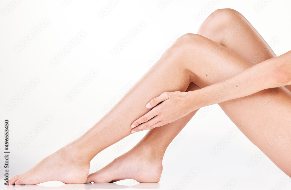 Youll fall in love with skin this soft. Cropped shot of an unrecognizable womans legs in studio against a grey background. Youll fall in love with skin this soft. Cropped shot of an unrecognizable womans legs in studio against a grey background.