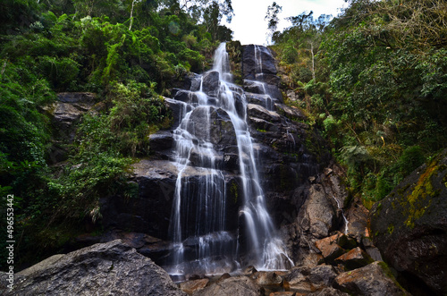 Véu da Noiva (Bridal Veil) waterfall surrounded by the lush subtropical montane rainforest of the lower sector of Itatiaia National Park, Itatiaia, Rio de Janeiro, Brazil photo