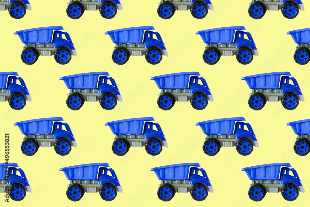 Colorful blue plastic dump truck, tip lorry, car toy isolated on yellow background still life seamless pattern,mockup, template, toys for children, boys, girls, kids development, playing, childhood