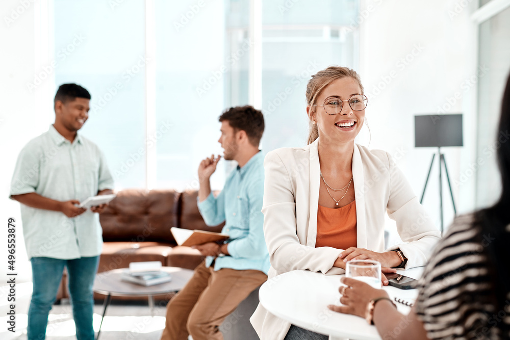 Its an awesome work environment. Cropped shot of a group of young businesspeople socializing in their office. Its an awesome work environment. Cropped shot of a group of young businesspeople socializing in their office.