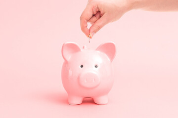 Piggy bank on pink background, budgeting concept