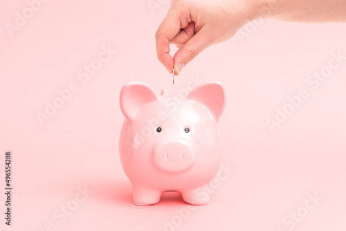 Vászonkép Piggy bank on pink background, budgeting concept