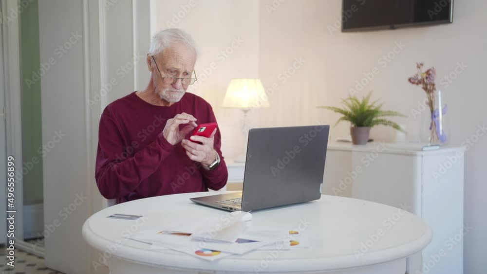 An elderly man learns to use a new phone and rejoices in his success An elderly man learns to use a new phone and rejoices in his success