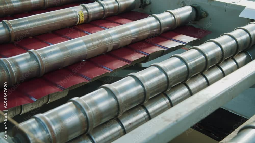 Close up metal sheet forming machine at the modern metalwork factory. Product, rollers, workshop, stainless. Close up metal sheet forming machine at the modern metalwork factory. Product, rollers, workshop, stainless.