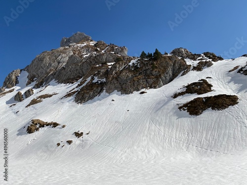 Rocky peak Dejenstogg or Dejenstock (2022 m) in the Glarus Alps mountain range, over the Klöntalersee (or Kloentalersee) reservoir lake and Klöntal alpine valley - Canton of Glarus, Switzerland photo