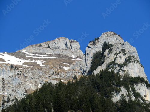 Rocky peak Dejenstogg or Dejenstock (2022 m) in the Glarus Alps mountain range, over the Klöntalersee (or Kloentalersee) reservoir lake and Klöntal alpine valley - Canton of Glarus, Switzerland