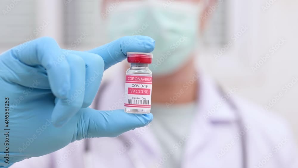 Video of doctor applying coronavirus vaccine into the syringe. Video of doctor applying coronavirus vaccine into the syringe.