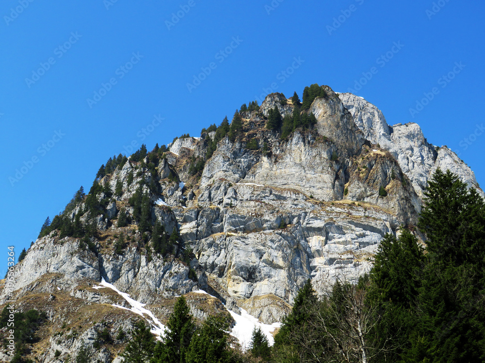 Rocky peak Mättlistock (Maettlistock or Mattlistock, 1911 m) in the Glarus Alps mountain range, over the Klöntalersee reservoir lake and Klöntal alpine valley - Canton of Glarus, Switzerland (Schweiz)