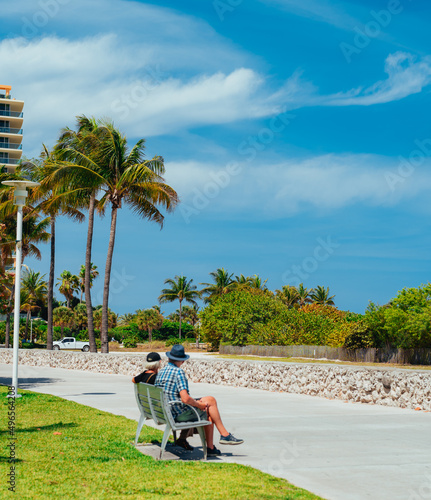 couple on the beach relax vacation hotel palms sky trees miami usa florida 