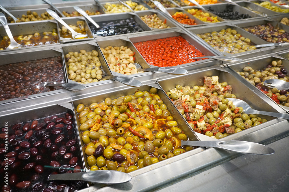variety of colorful fresh olive and vegetable salad in restaurant