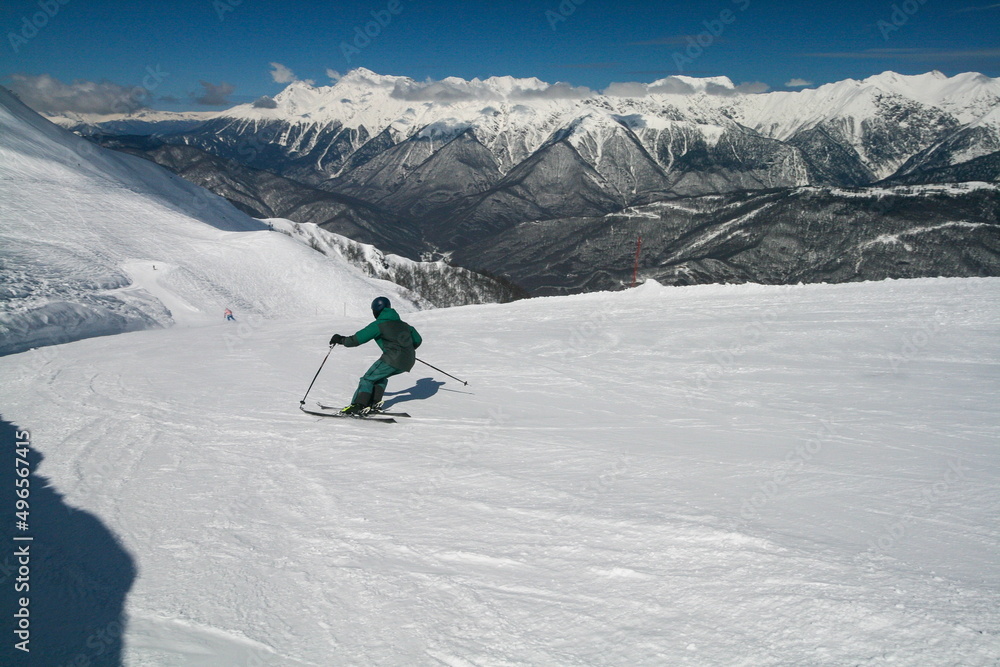A skier on the slopes of a ski resort, Sochi, Russia. A skier on the slopes of a ski resort, Sochi, Russia.