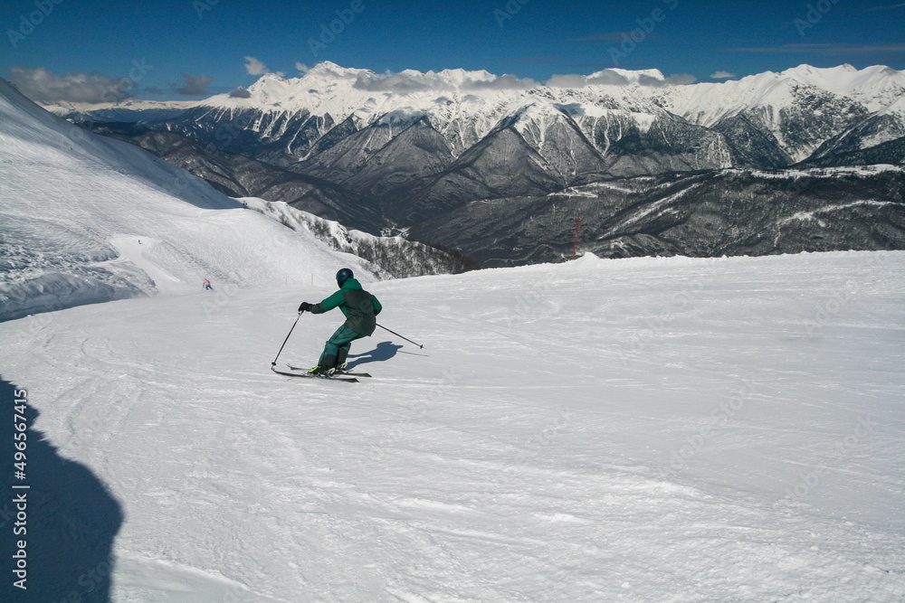 A skier on the slopes of a ski resort, Sochi, Russia.