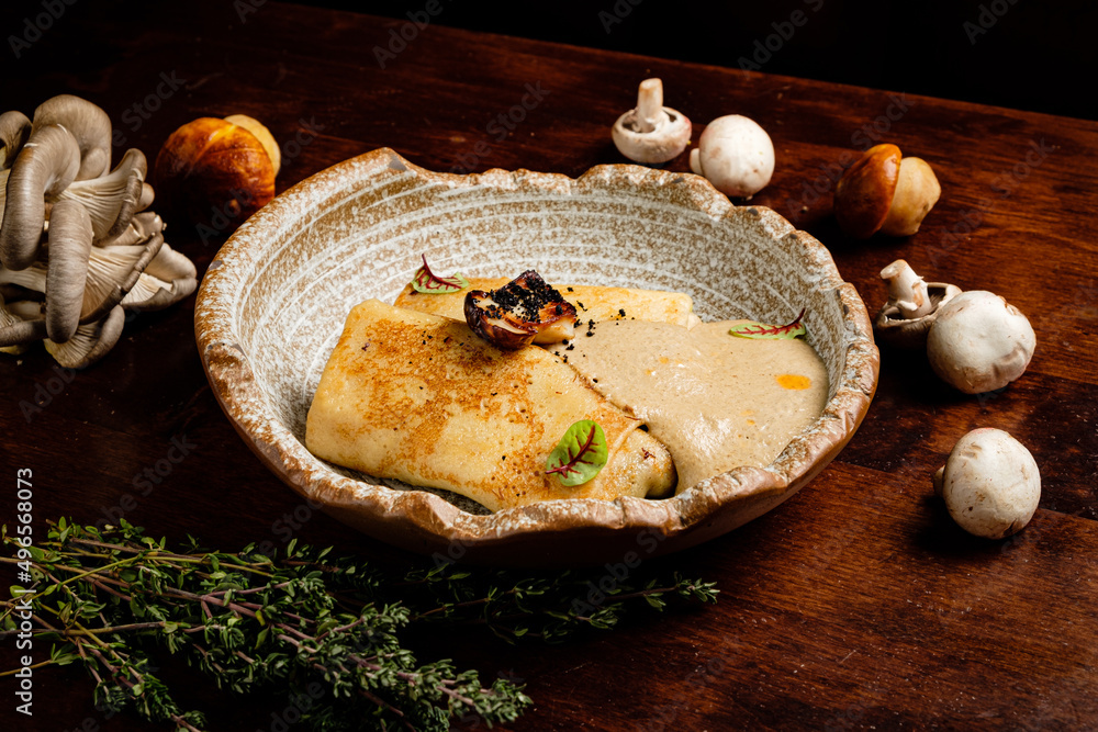 Fototapeta premium pancakes with mushrooms and herbs