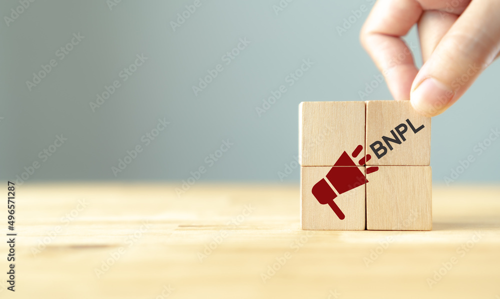 Buy now pay later BNPL online shopping concept. Online shopping, internet retail and e-commerce. Customer service, net payment terms. Wooden cubes with BNPL abbreviation, horn icon. Promotion banner. Buy now pay later BNPL online shopping concept. Online shopping, internet retail and e-commerce. Customer service, net payment terms. Wooden cubes with BNPL abbreviation, horn icon. Promotion banner.
